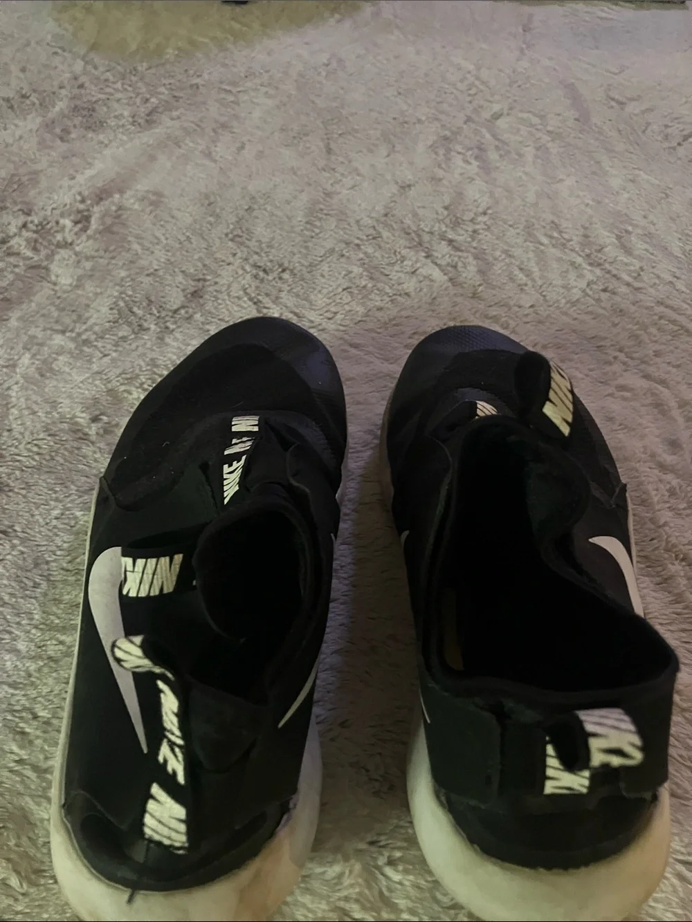 Nike Black Slip-On Athletic Shoes with White Swoosh Accent